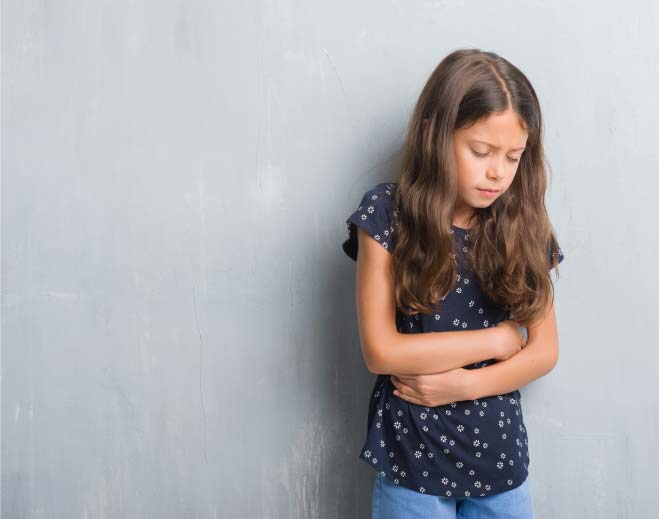 young girl holding stomach